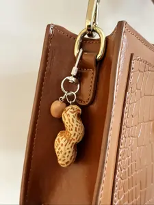 A fashionable and versatile imitation peanut keychain, a light luxury imitation peanut granule bag portable pendant, suitable for keybags, backpacks, pendants, and accessories, Trendy Cute Keychain