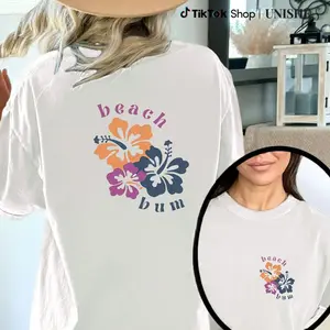 "Beach Bum" Floral Print Women's Pink T-shirt - Casual round neck, machine washable, ready for summer, with vibrant designs of hibarium and palm