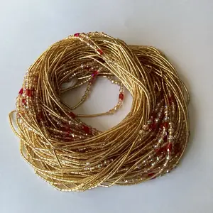 Rich Aunty Gold-Color Item with Red and White Accents as Described