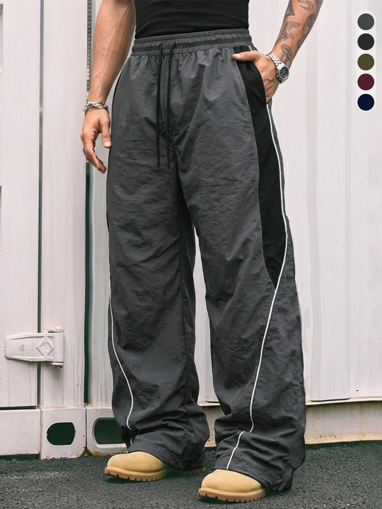 Men’s outdoor functional dark gray athletic pants — minimalist relaxed fit, elastic waistband for everyday wear and streetwear; dark functional style, American campus vibe, sporty casual style; Y2K retro wide-leg nylon athletic pants.