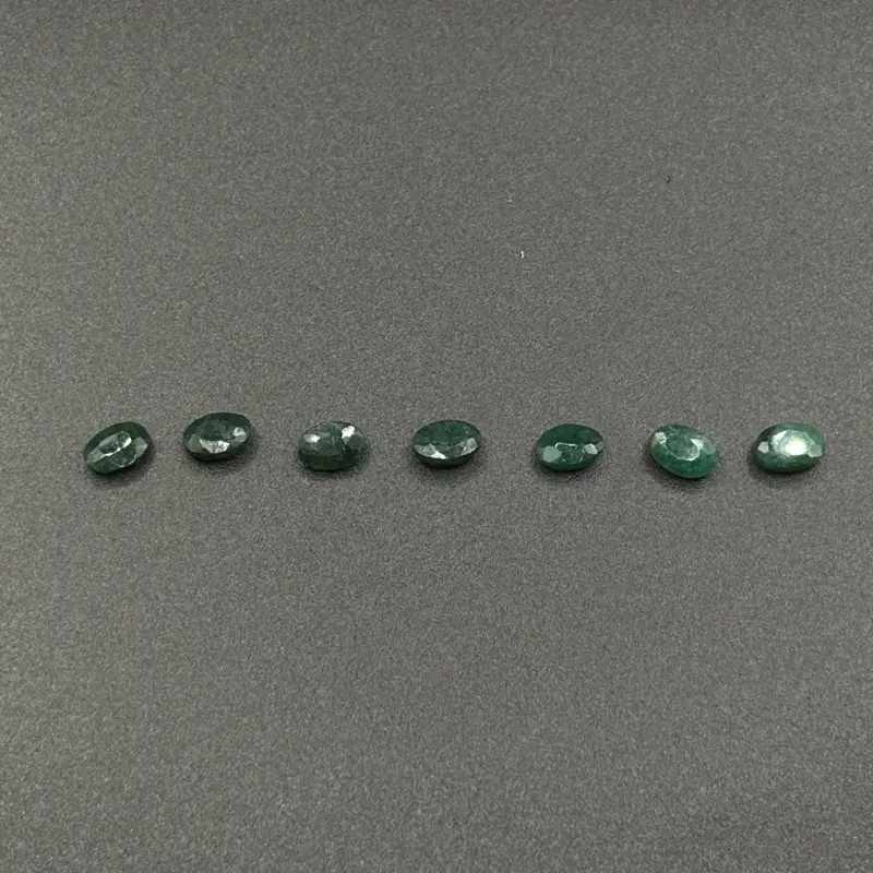 14.58 TCW Lot COMMERCIAL GRADE Rough Faceted Varying Shade Emeralds, Heavily Included, 6 x 4mm Oval Gemstones, 7pcs
