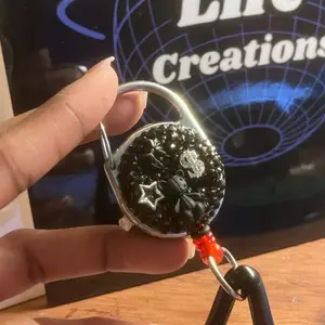 back and silver hand customized retractable lighter leash.