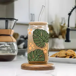 Tropical Monstera Leaf 16oz covered straw glass drinking cup, reusable glass drinking cup, high-quality glass jar design, suitable for iced coffee, beer, juice, milk, cold drink glass cups, fashionable glassware. Perfect gift for coffee lover