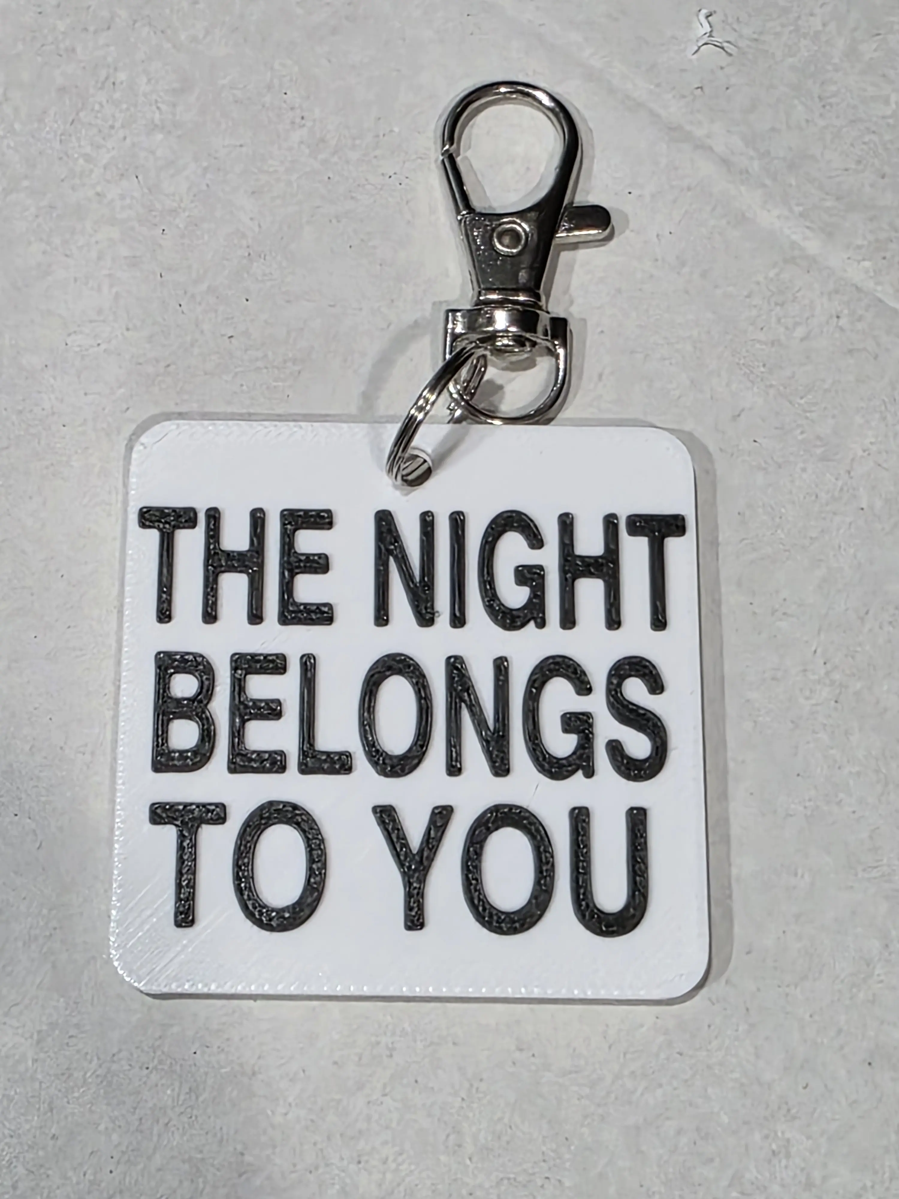 "THE NIGHT BELONGS TO YOU" 3D Printed Keychain Charm, Fashion Accessory with Silver-Tone Hook, Black Lettering, Personalized Message Keychain - Ideal Gift for Loved Ones, 3D Printed Keychains, Keychain Charm Keychains
