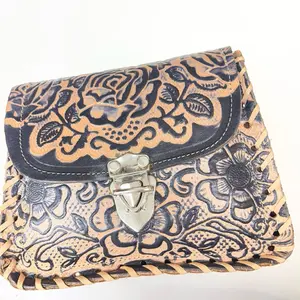 Handcrafted Leather Bag with Intricate Floral Embossing and Secure Buckle Closure for Everyday Use