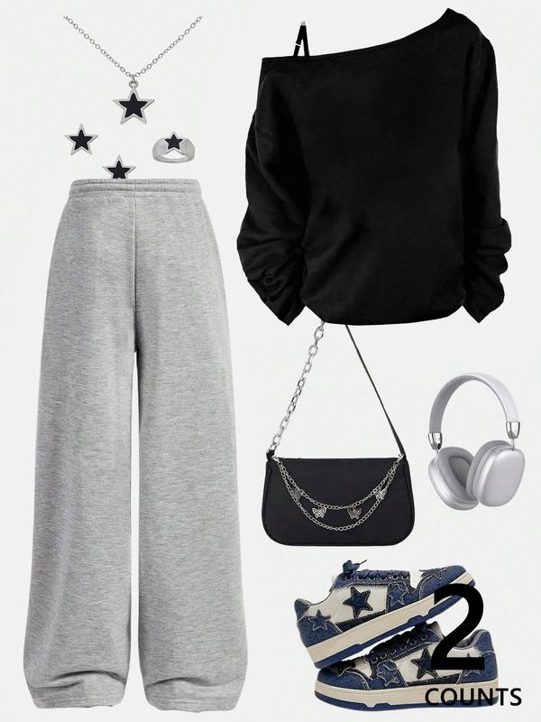 A teenage girl's off-shoulder top and wide-leg casual trousers; a loose-fitting, oversized casual long-sleeved top with a letter print paired with loose-fitting drawstring trousers; soft, suitable for women, and versatile.