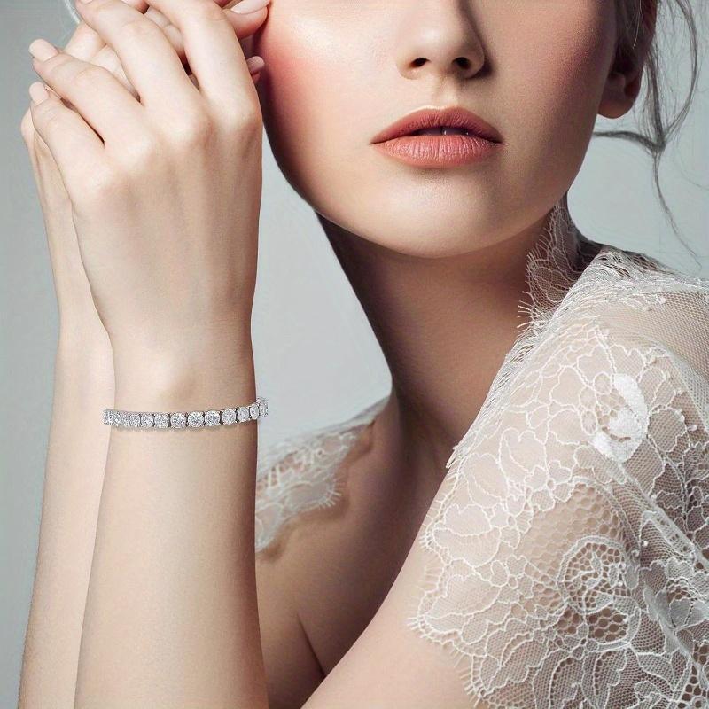 A Luxurious Moissanite Tennis Bracelet with a Carat Weight of 10.5-14, Made from 925 Silver, Featuring Stunning Round Cut Stones And a Secure Clasp. This Elegant Piece Is an Ideal Gift for Both Men And Women, Especially for Christmas
