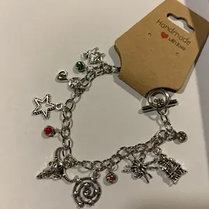 Handmade Halloween Charm Bracelet with Assorted Charms, Silver Finish, and Decorative Elements