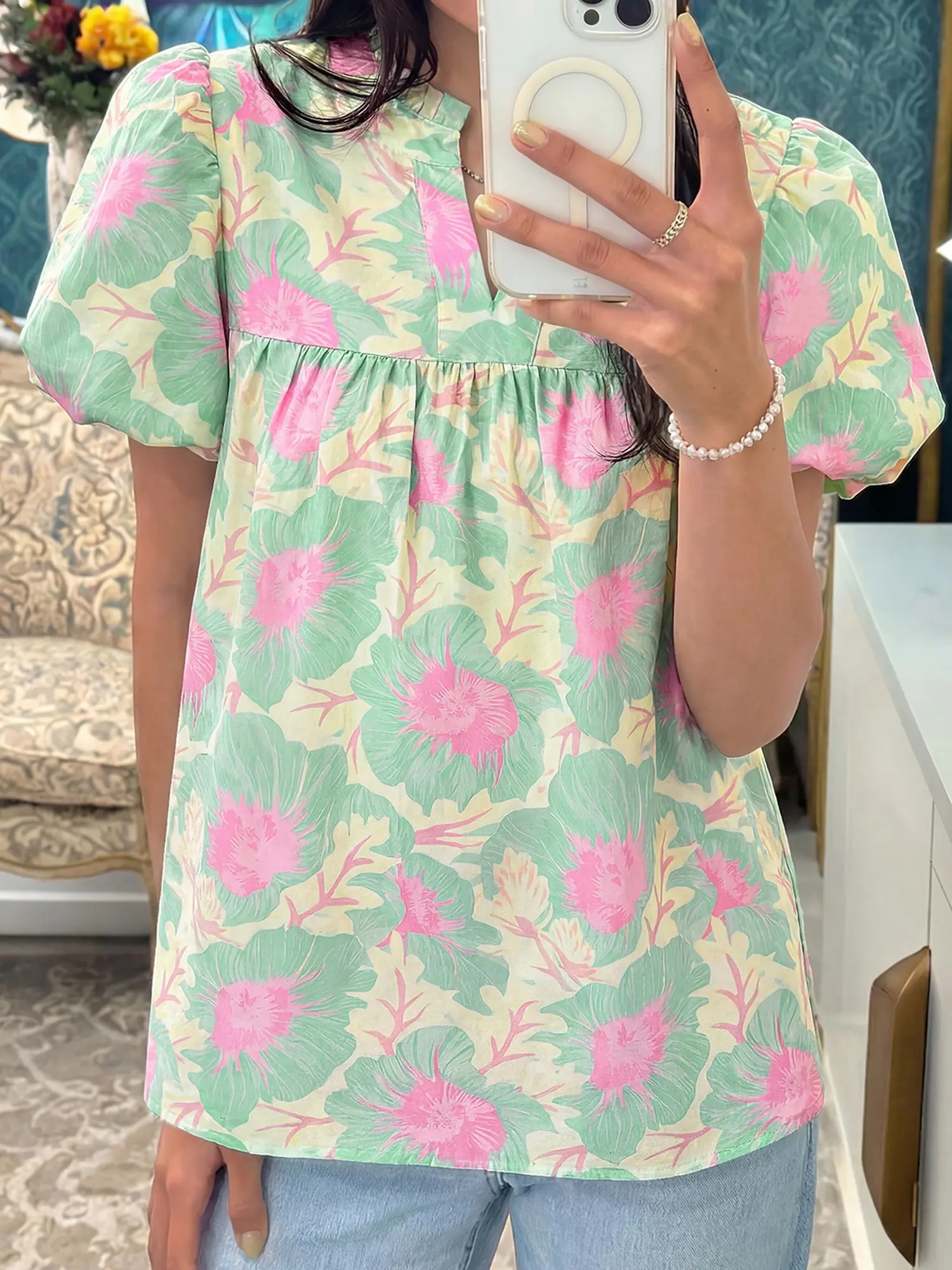 Short Bubble Sleeve Summer Floral Blouse, Babydoll Style With a Notched V Neck and Bubble Sleeves.