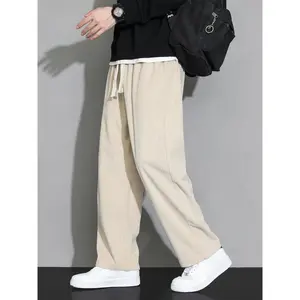 Men’s plain corduroy sweatpants with a drawstring waist and pockets; fashionable loose, baggy straight-leg pants for men; fall pants for men; streetwear trousers/menswear; laid-back, drip-worthy going-out outfit; fresh autumn clothing; apricot.