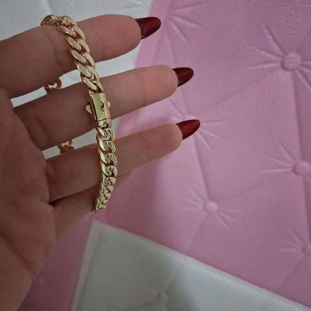 14 k gokd plated ,bracelet.8mm thick by 6.5 inches long .