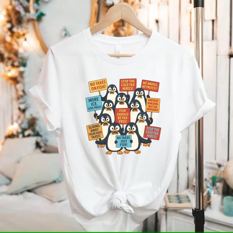 Funny Penguins Against Taxes T-Shirt – Anti Tariff Protest Shirt – No Tax For Penguins Tee – Political Humor Gift – Anti-MAGA Resistance
