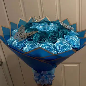 Blue Rose Bouquet with Elegant Butterfly Accents in Luxurious Blue Packaging for Special Occasions Ideal for Gifting on Birthdays Anniversaries