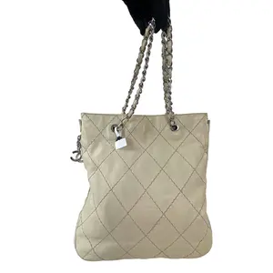 Pre-owned CHANEL leather Crossbody Bags vintage quilted chain tote bag in beige with silver tone hardware.+Bag charm+++