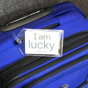 I am lucky™ + I am optimistic™ luggage tag