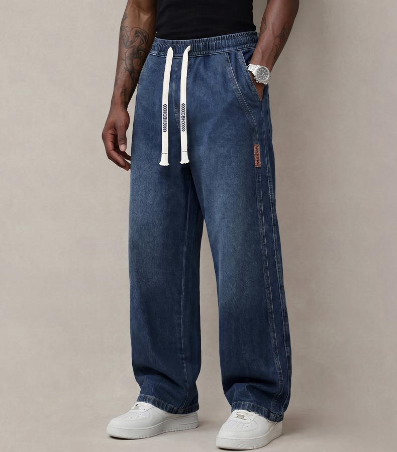 Men’s jeans made from stretchy cotton—comfortable and stylish. Loose fit for everyday wear; long pants with a drawstring elastic waistband design for men.
