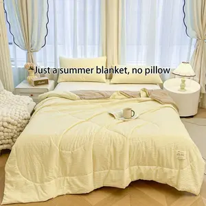 A summer quilt with a puffy texture and yellow-and-white checkered pattern—a soft, skin-friendly, and lightweight air-conditioning quilt Puffed quilt perfect for summer use in bedrooms, offices, on beds, in living rooms, and for home relaxation