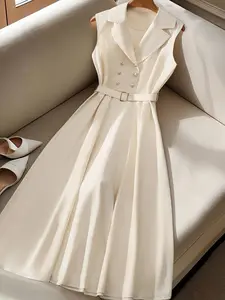 A women's light gray suit style lapel double-row metal button sleeveless chic dress, suitable for summer, suitable for daily commuting, light business meetings dating or small gatherings.