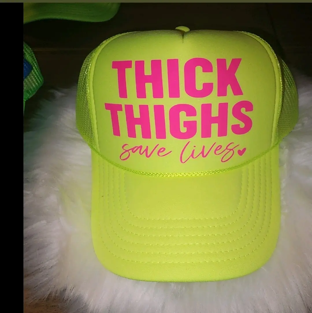 Thick Thighs Save Lives Yellow Trucker Hat with pink writing Adjustable Fit and Snapback Design