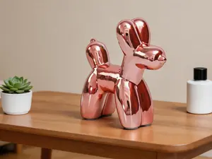 Cute ceramic balloon dog statue ornament. Handcrafted modern animal decor, ideal for desktop and living room accent display.