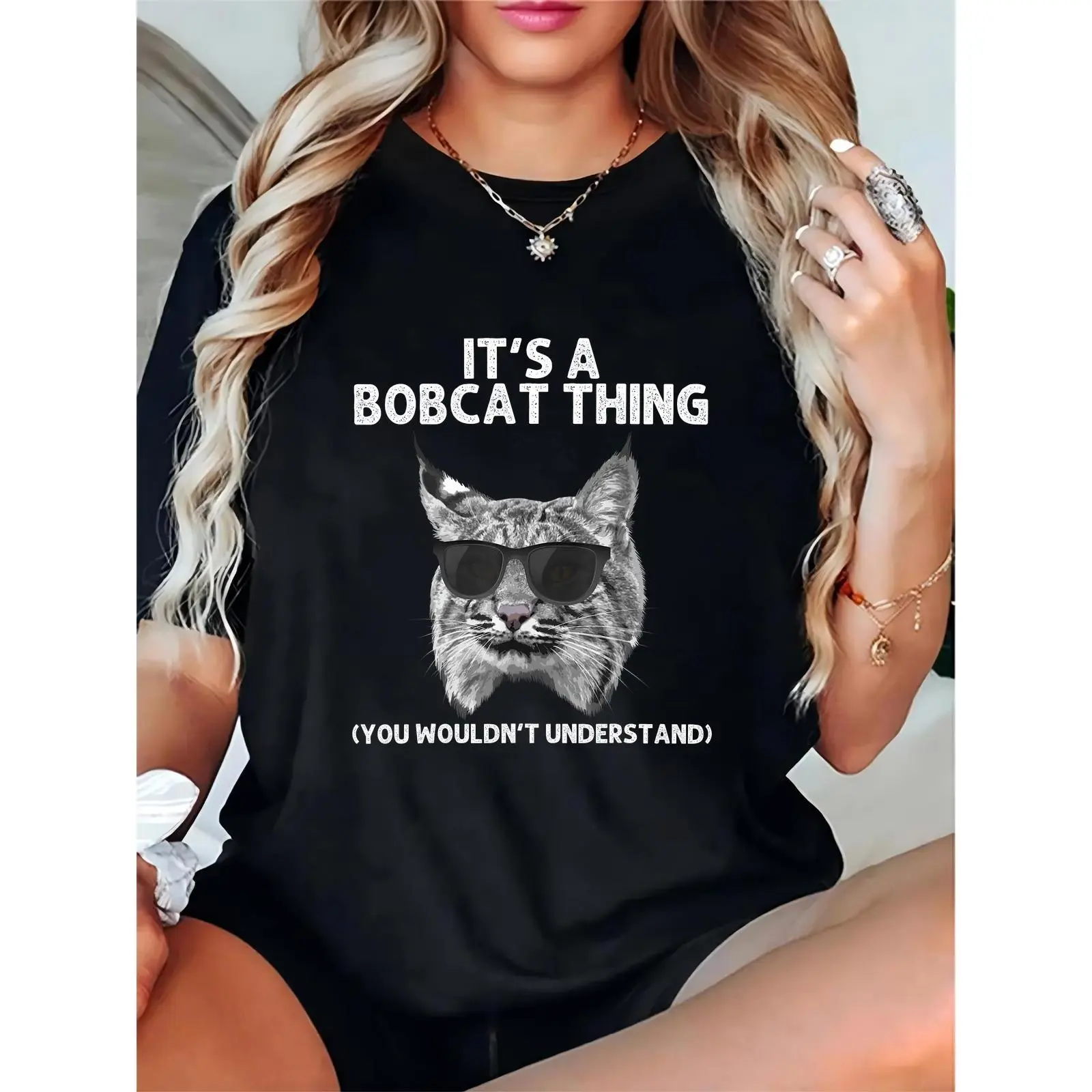 Women's Black Graphic Tee | Cool Bobcat in Sunglasses + "It's a Bobcat Thing" Quote | Casual Daily, Outdoor, Gifting for Bobcat Lovers, Animal Enthusiasts 100% Cotton T-shirt