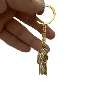 San Judas Key Chain - Gold-Toned Figure with Crystal Accents and Chain Attachment