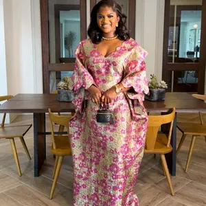 Arwa brocade elegant dress for women to standout on any occasion has a ruffled cut design on the neck and sleeve comes with a headwrap and inner cinching belt Maxi