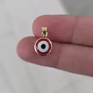 Ojo Turco Red Pendant - Simple Red and Gold-Toned Design Item Charms