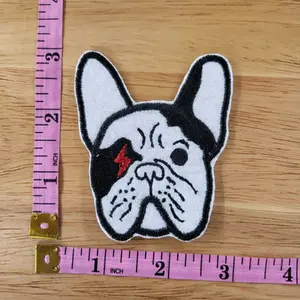 Embroidered Frenchie Bulldog patch in black and white with lightning strike for one of his eyes.