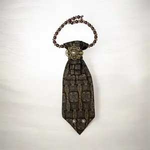 Brown and beige tie with antique-looking brooch