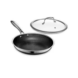HexClad Hybrid Nonstick 10-Inch Frying Pan with Tempered Glass Lid, Stay-Cool Handle, Dishwasher-Friendly, Oven-Safe Up to 900°F, Induction Ready, Compatible with All Cooktops