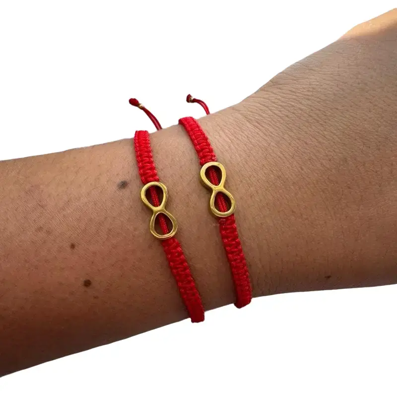 Bracelets to share, made of nylon thread with golden steel and stainless white charms. Handmade with love.