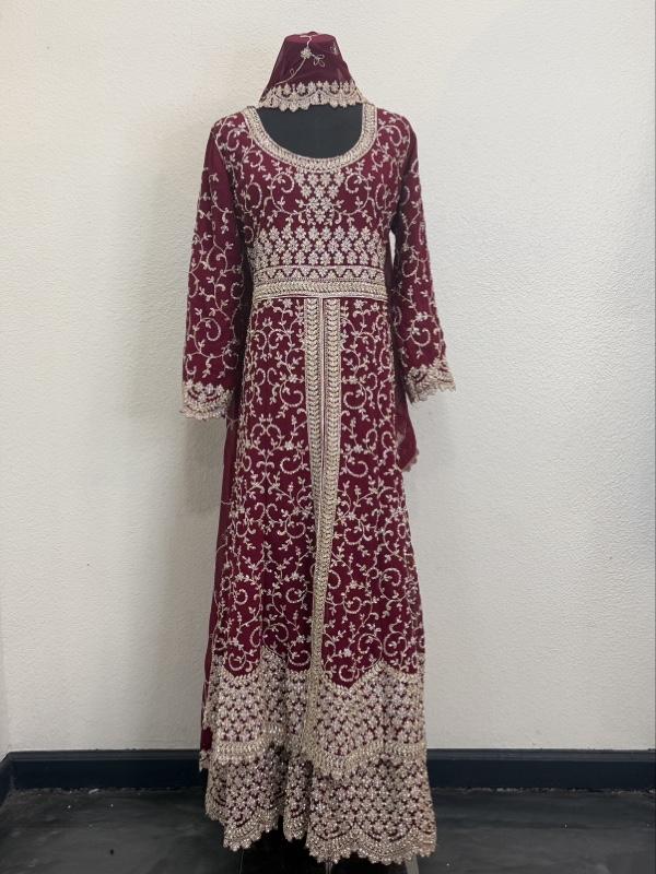 This image shows a green designer heavy embroidered bridal lehenga or Anarkali suit suited for traditional Indian weddings. Womenswear