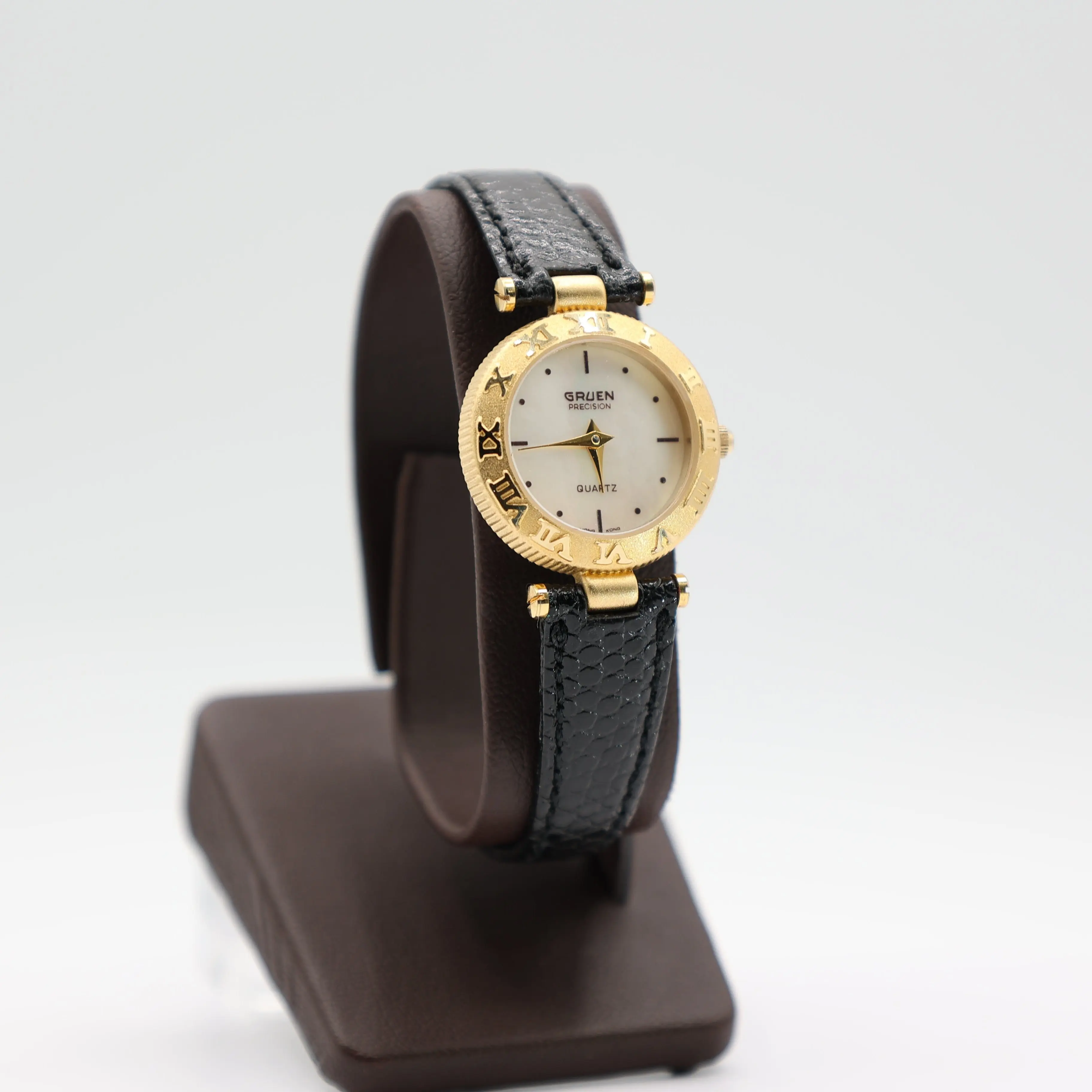 Gruen Precision Gold Tone Watch With Mother Of Pearl Dial And Black Leather Band