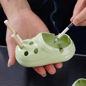 2026 New Hole Shoe Shaped PP Plastic Ashtray, minimalist compact design. Waterproof, durable and lightweight, a stylish desktop ornament and practical home gift.