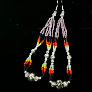 A pair of handmade Navajo beaded earrings, embellished with moderate purple seed beads, fire designed seed beads and silver plated rose buds.