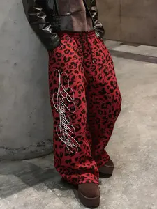 Stylish red and black leopard print oversize wide-leg pants, men's street-style elastic waist casual trousers, retro 90s vintage faded loose sweatpants, eye-catching animal print jogger pants, ideal for urban outfits, night outings and skateboarding style