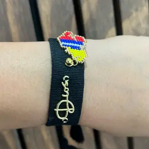 Handmade black bracelet with the map of Venezuela woven into it