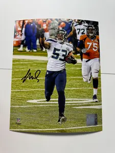 Malcolm Smith Seattle Seahawks Autographed 8" x 10" Running and Pointing Interception Photograph