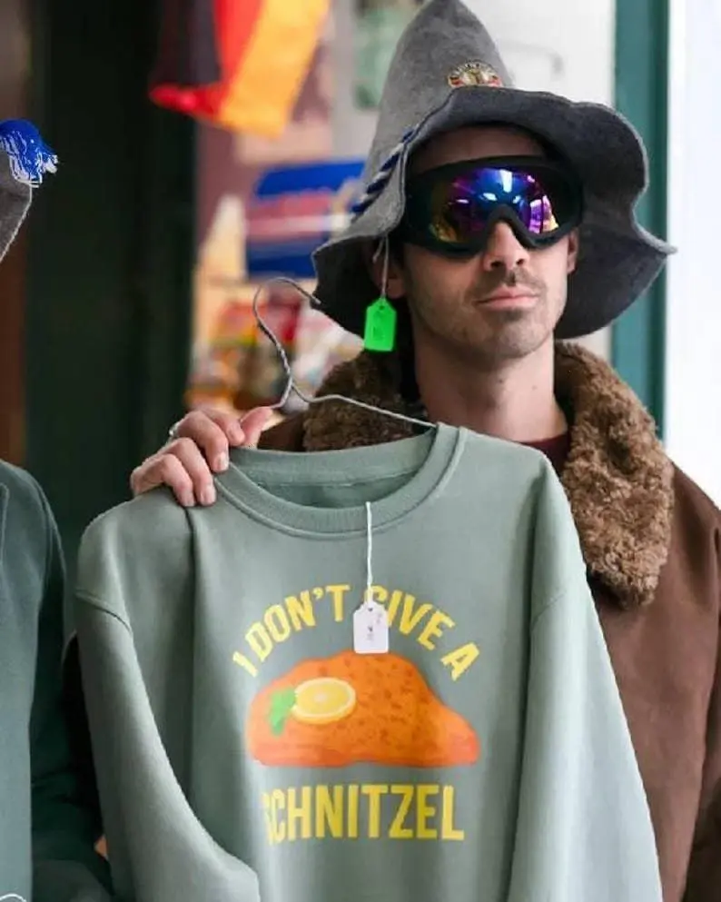 [SALE UP TO 30%] I Don�t Give A Schnitzel Sweatshirt, Funny Holiday Sweatshirt as Seen in "A Very Jonas Christmas", Christmas Gift for Fans, Unisex Crewneck Sweatshirt, T-shirt Unisex Crewneck Made Using 100% US Cotton, Design & Printed In The USA
