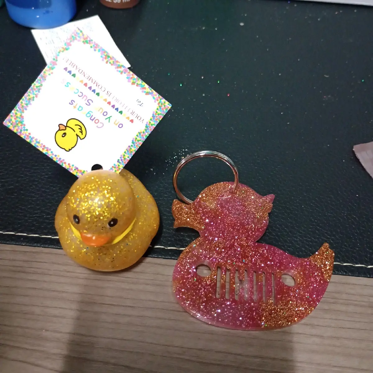 Pink & gold glitter duck keychain with gold glitter squeak duck.