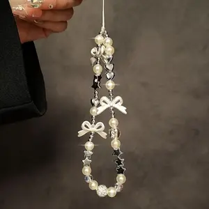 A luxurious and exquisite creative bow decoration mobile phone pendant with star heart elements, mobile phone bag, CCD headphone cover, hanging chain, Phone Charms, Phone Accessory