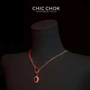 Golden Silence Luxe Necklace - Gold chain with heart-shaped pendant, red gemstone and multi-layered links