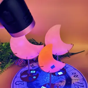 Pink Mangano Calcite Crescent Moon on Stand UV Reactive Glow Decorative Item with Unique Design Features