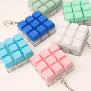 A mini keyboard-style pressable charm—the perfect little stress-relief accessory or small gift for friends and family.