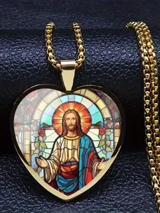A transparent glass heart-shaped necklace with a 2D vintage-style, intricately detailed image of Jesus inside.