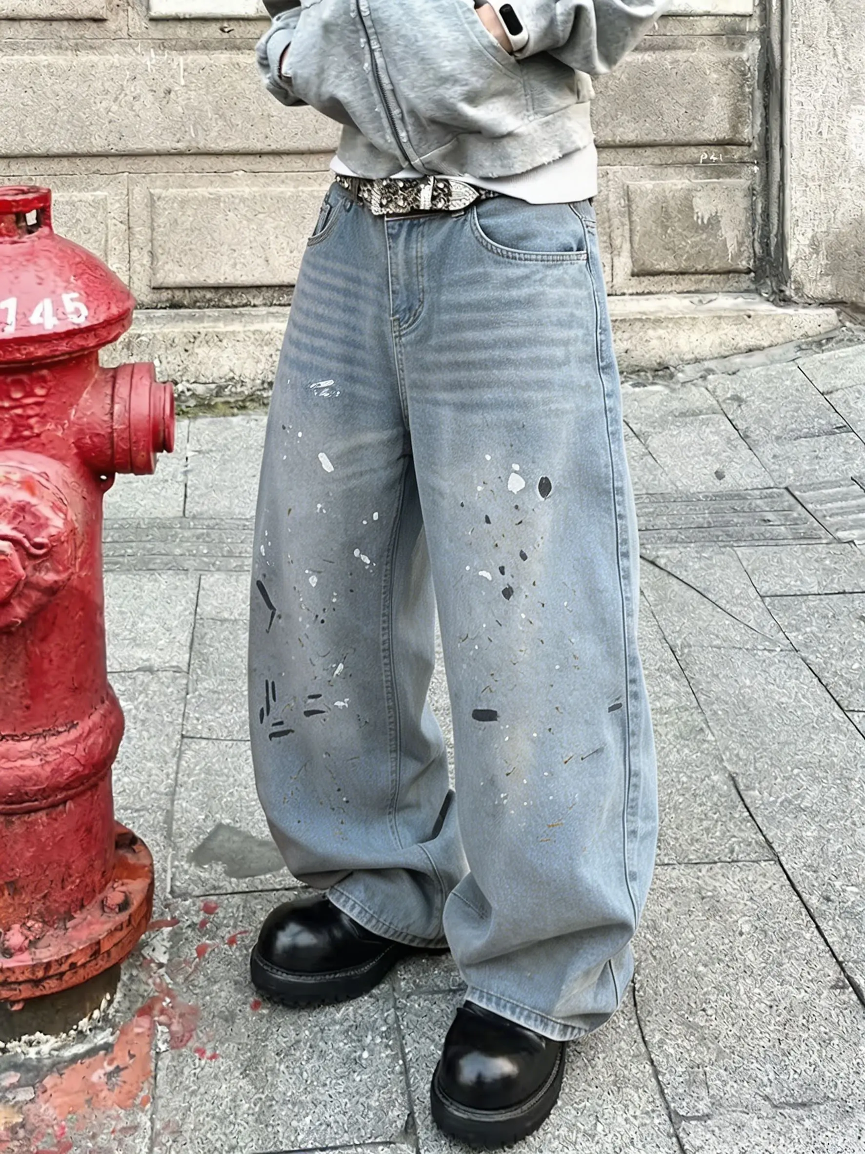 Light blue distressed hand-painted spray dot wide-leg jeans — front panel gradient wash graffiti, drapey floor-length pants; Instagram high-street retro influencer style, versatile casual everyday long pants