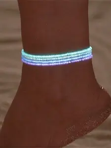 This 4-piece ladies' anklet set, crafted with luminous colored acrylic rice beads and elastic cords, has a glowing feature that shows charm at night, Trendy Jewelry