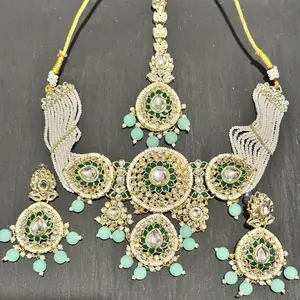 Elegant Gold-Tone Kundan Necklace Set with Maroon Bead Drop Earrings & Maang Tikka