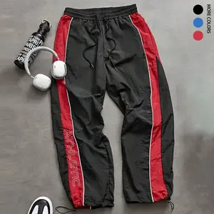 Men’s casual sporty long pants, athleisure pants, loose fit with elastic cuffs, fashionable print, lightweight fabric, perfect for everyday wear